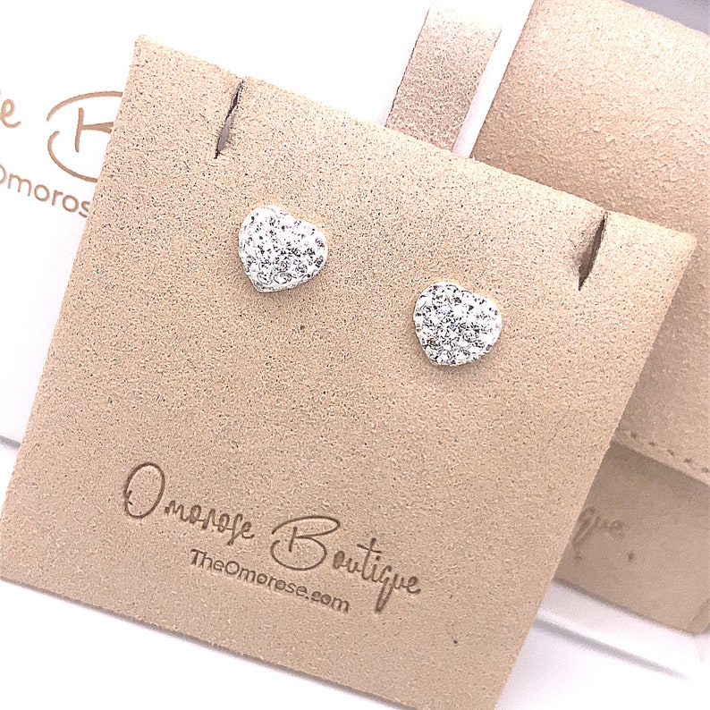 Sterling silver heart earrings studded with crystal glass.